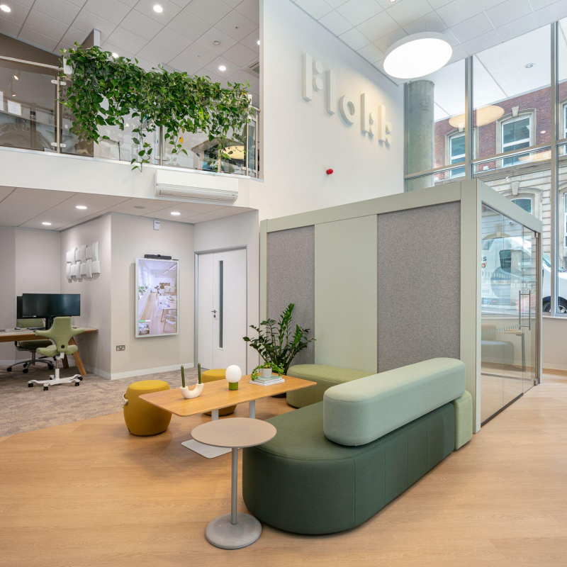 Showroom shot within includes mezzanine and flokk sign