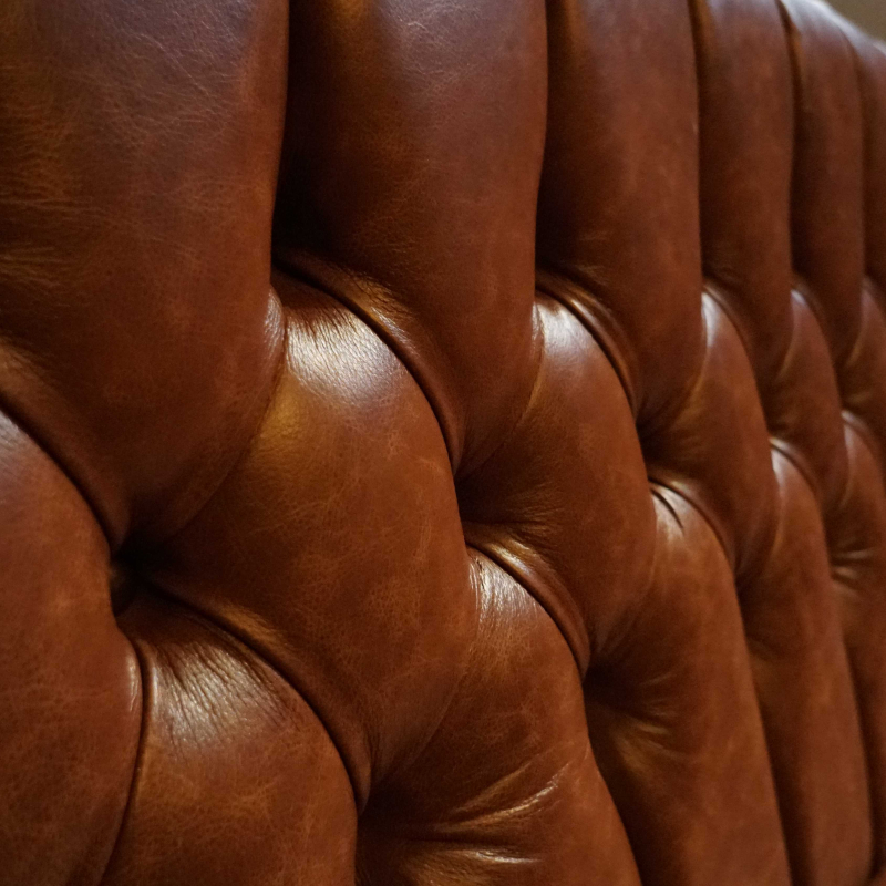 leather bench detail shot of buttons and stitching
